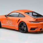 Porsche 911 992 Turbo S China 20th Anniversary Oranžna Minichamps 1:18 - image 5 of 6