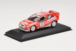 Ford Escort Cosworth Toshiba #11 A. Vatanen / Freeman 1994 Minichamps 1:43 430981811 Kovina – slika 2 od 4